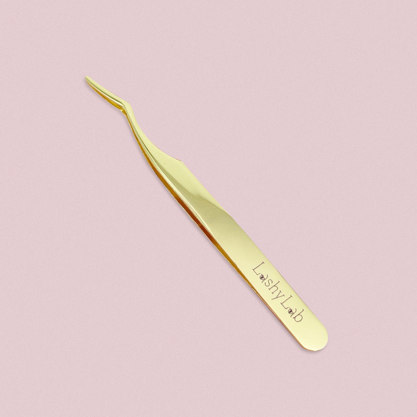 Lash tweezer by Lashy Lab against a soft pink background—ideal for easy lash application and better control.