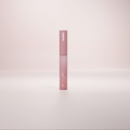 A pink tube labeled Lashy Lab LASH OFF REMOVER stands upright on a softly lit background, its minimalist design highlighting its use for cluster lashes against a gentle gradient backdrop.
