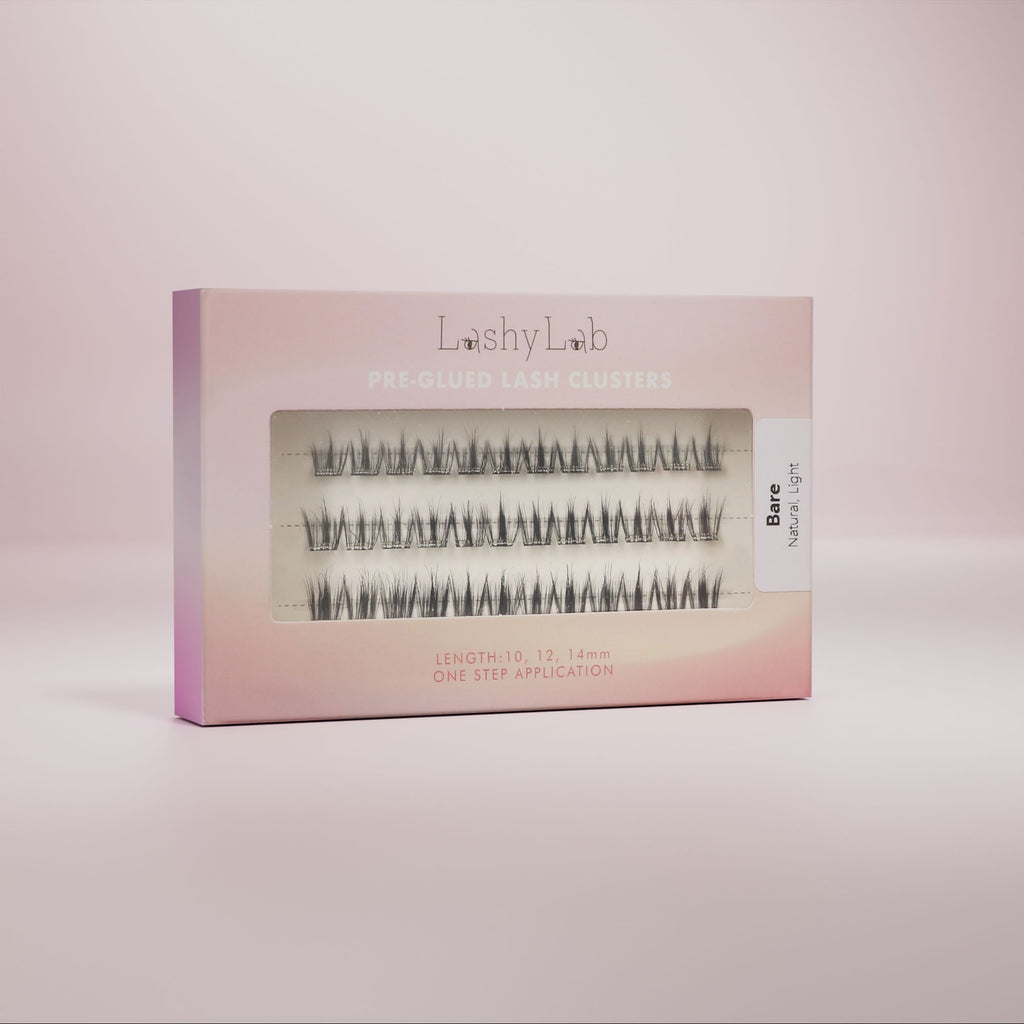 A box of pre-glued false eyelashes presented against a neutral background, with the brand name 'Lashy Lab' visible on the packaging.