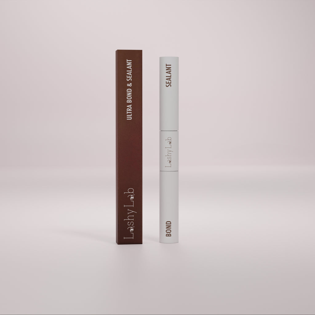A white tube labeled Lashy Lab BOND & SEALANT stands upright on a softly lit background, its minimalist design highlighting its use for cluster lashes against a gentle gradient backdrop.