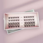 The Lashy Lab MOONLIGHT - Subtle, Light, Flare underlash extensions come in a pink box with four rows of cluster lashes—8mm, 10mm, 12mm, and 14mm—neatly displayed on a soft pink surface for easy application.
