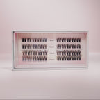 Lashy Labs NIGHT OUT diy pro cluster lashes in lengths 8mm, 10mm, 12mm, and 14mm come in multiple rows on a soft pink backdrop—full, voluminous, and sassy lashes that stay on for weeks.
