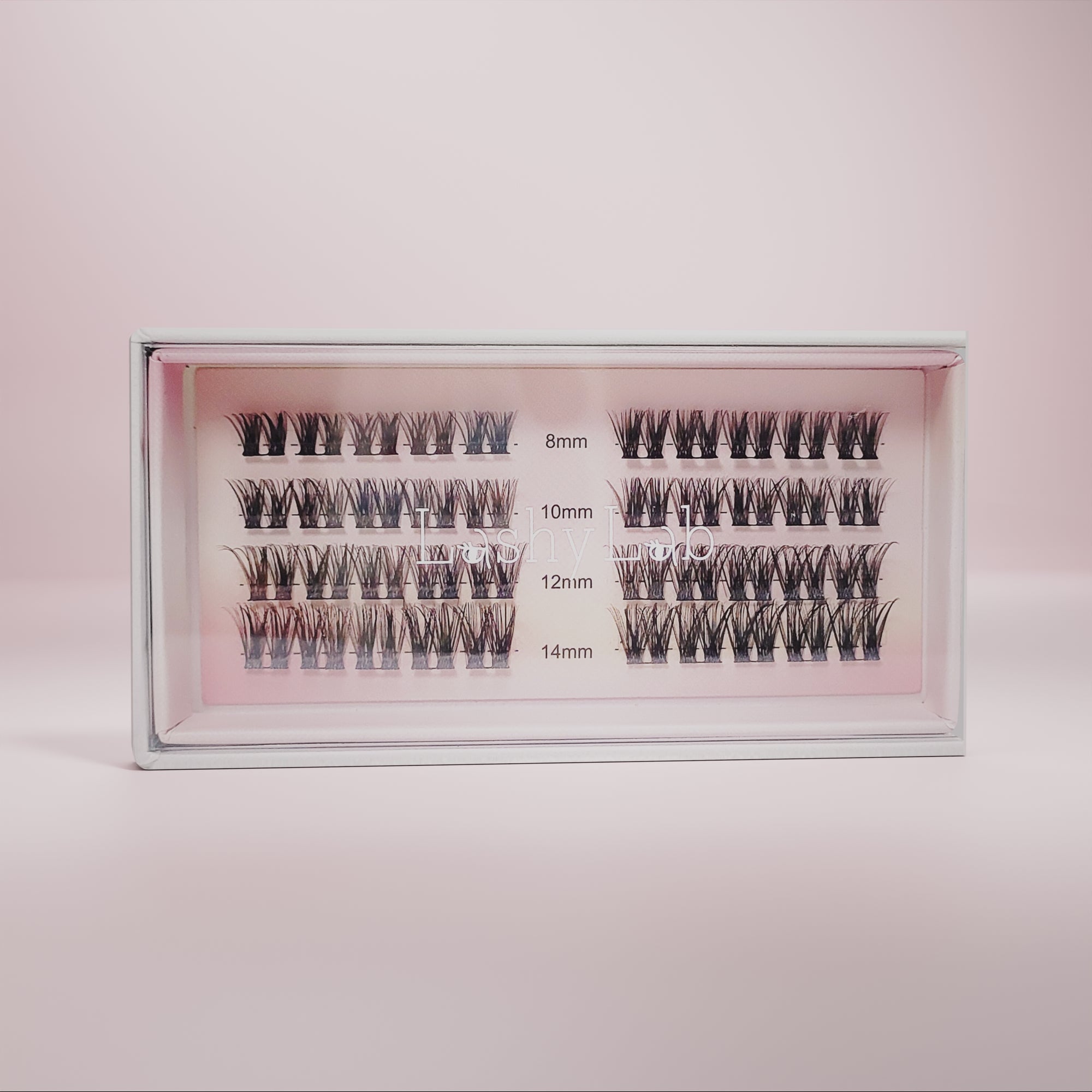 Lashy Labs NIGHT OUT diy pro cluster lashes in lengths 8mm, 10mm, 12mm, and 14mm come in multiple rows on a soft pink backdrop—full, voluminous, and sassy lashes that stay on for weeks.